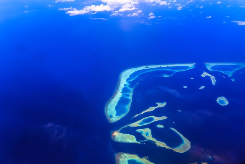 Tuvalu coastal erosion aerial Pacific atoll lagoon