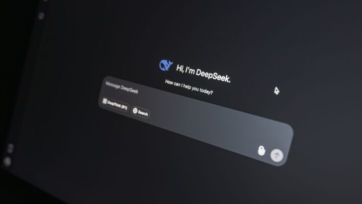 Close-up of DeepSeek AI chat interface on a laptop screen in low light.