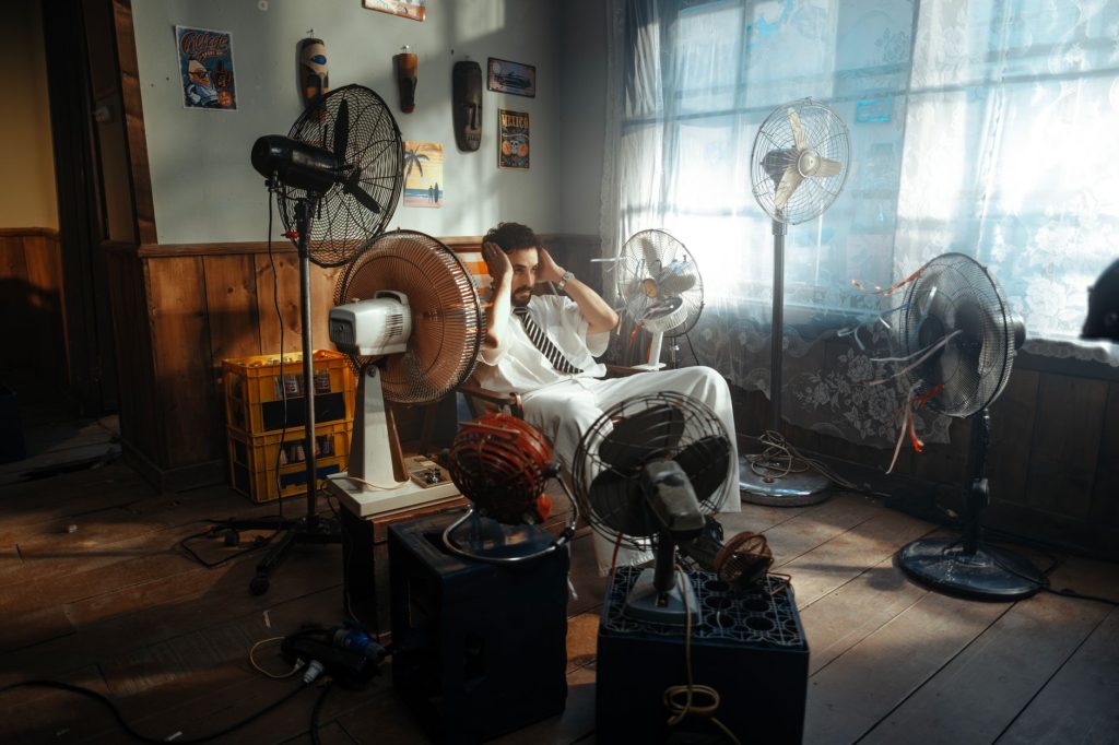 Elderly person heat exhaustion symptoms cooling fan