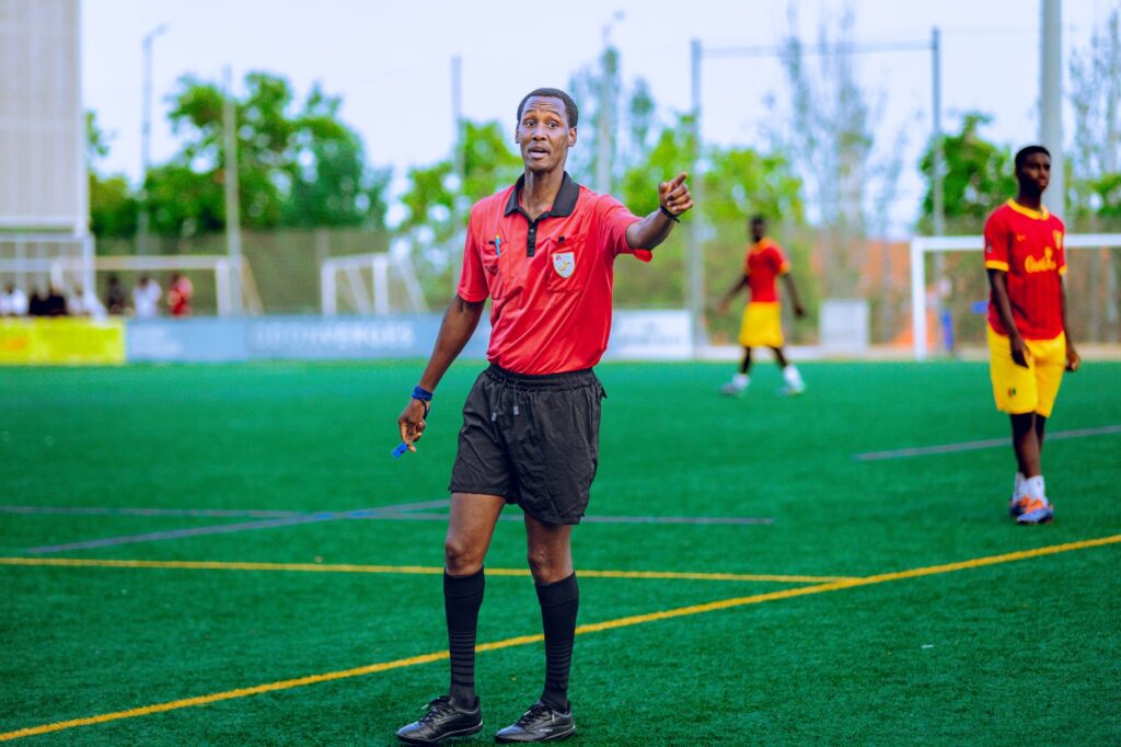 Premier League match referee using VAR monitor