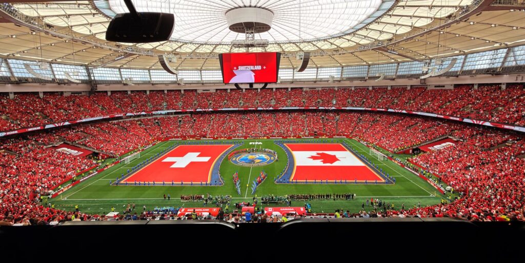 A vibrant soccer match between Switzerland and Canada in BC Place, Vancouver. 文章配图
