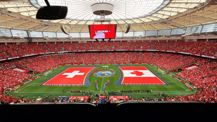 A vibrant soccer match between Switzerland and Canada in BC Place, Vancouver. 文章配图
